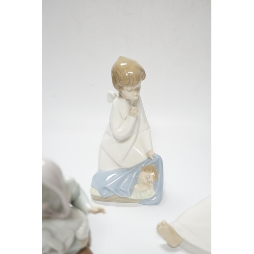 438 - Five Lladro figures; two angelic, two nativity, one of a sleeping child and another of a girl with a... 