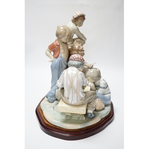 448 - A large Nao figure group on stand of five boys sitting around a table playing cards, 33cm