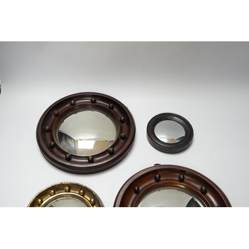 452 - A pair and two other small convex wall mirrors, largest 23cm