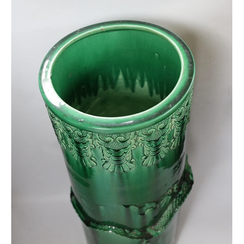 466 - An early 20th century Japanese green glazed dragon stick stand, 61cm