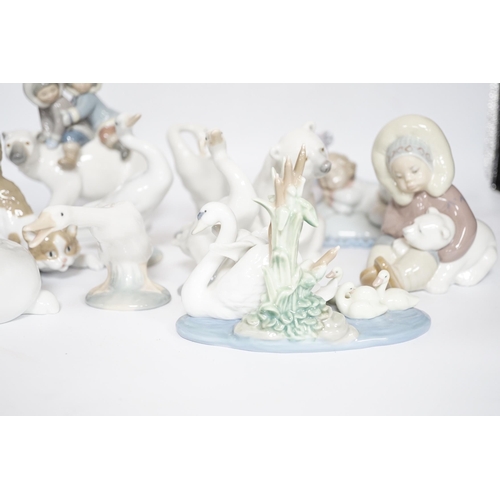 469 - Eleven Lladro figure groups, including a collection of ducks, two Eskimo figure groups, a sleeping c... 