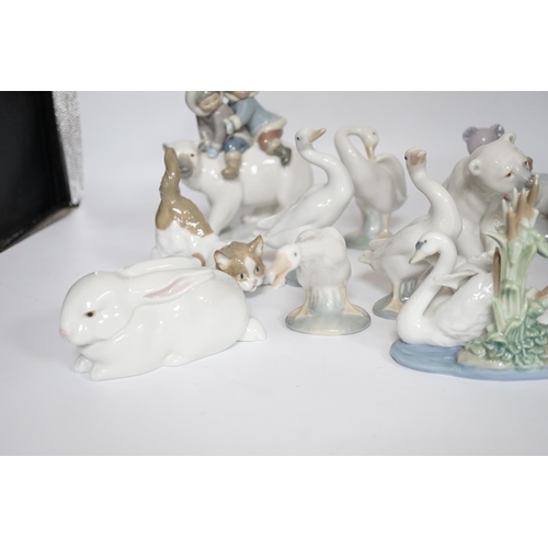 469 - Eleven Lladro figure groups, including a collection of ducks, two Eskimo figure groups, a sleeping c... 