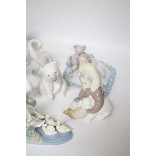 469 - Eleven Lladro figure groups, including a collection of ducks, two Eskimo figure groups, a sleeping c... 