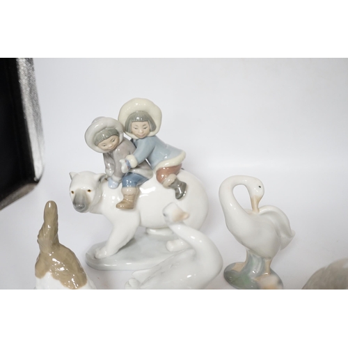 469 - Eleven Lladro figure groups, including a collection of ducks, two Eskimo figure groups, a sleeping c... 