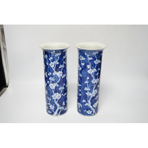 480 - A pair of Chinese blue and white prunus flower sleeve vases, c.1900, (restored), 26cm high