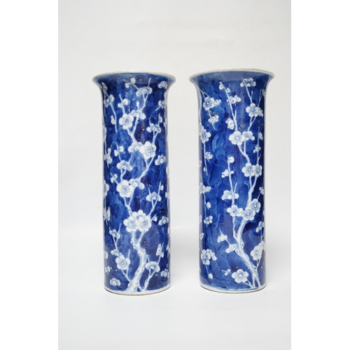 480 - A pair of Chinese blue and white prunus flower sleeve vases, c.1900, (restored), 26cm high