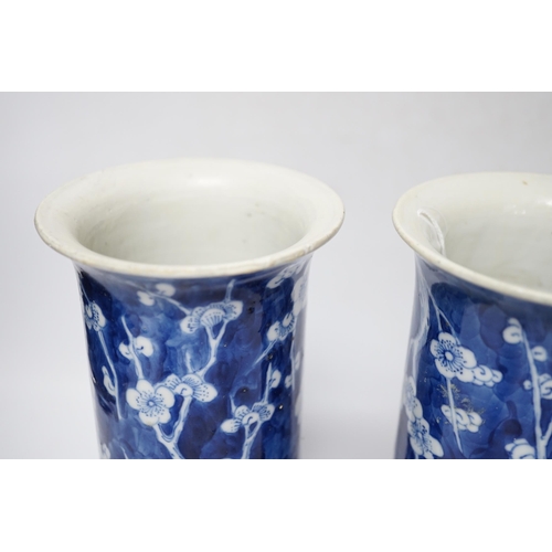 480 - A pair of Chinese blue and white prunus flower sleeve vases, c.1900, (restored), 26cm high