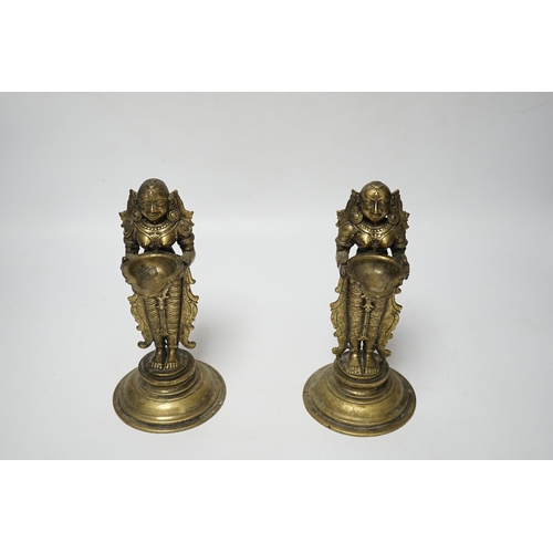 481 - A pair of 19th century Indian Deepalakshni butter oil lamps, 19cm high, Provenance: acquired on tr... 