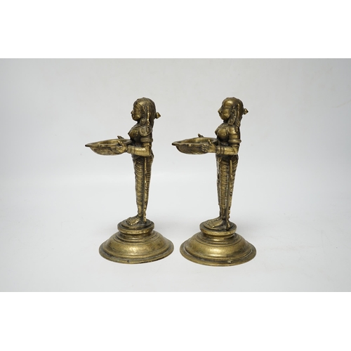 481 - A pair of 19th century Indian Deepalakshni butter oil lamps, 19cm high, Provenance: acquired on tr... 