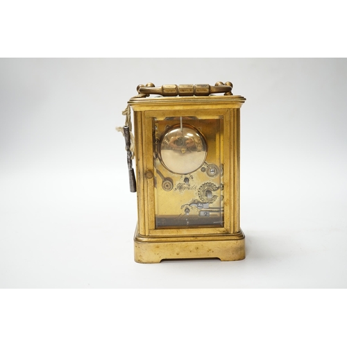 490 - A brass carriage clock with subsidiary dial, 16cm high