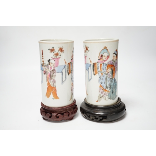 491 - A pair of Chinese cylindrical famille rose brush pots on associated stands, largest 15cm high overal... 