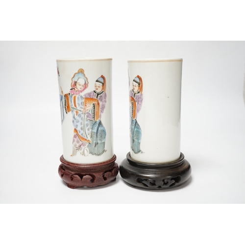 491 - A pair of Chinese cylindrical famille rose brush pots on associated stands, largest 15cm high overal... 