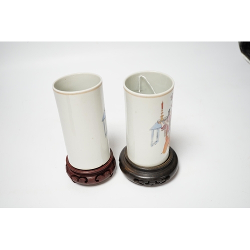 491 - A pair of Chinese cylindrical famille rose brush pots on associated stands, largest 15cm high overal... 