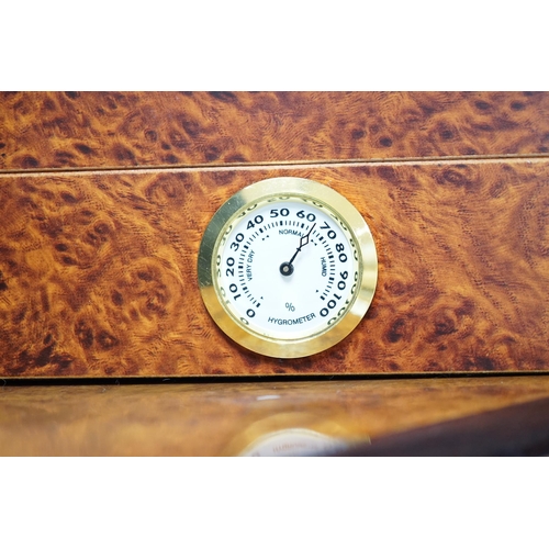 503 - Two burr wood humidors, one with contents including Cohiba