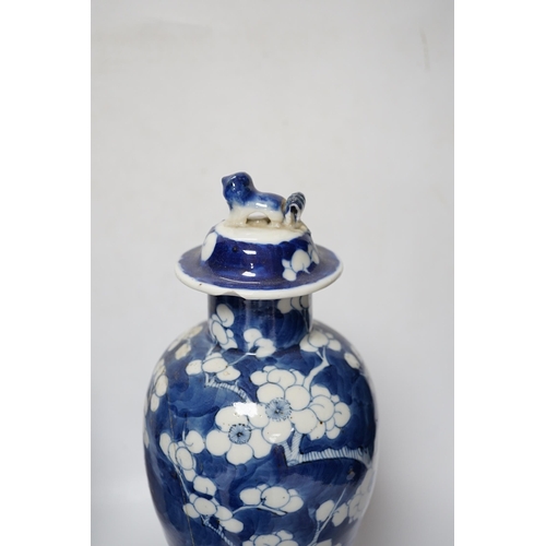 504 - Five early 20th century Chinese blue and white prunus vases and covers, tallest 31cm