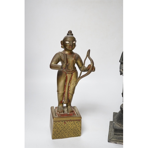 506 - A 19th century Indian Deepalakshni butter oil lamp and an 18th century Indian brass figure of Koda... 