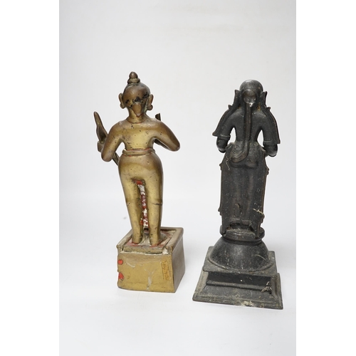 506 - A 19th century Indian Deepalakshni butter oil lamp and an 18th century Indian brass figure of Koda... 