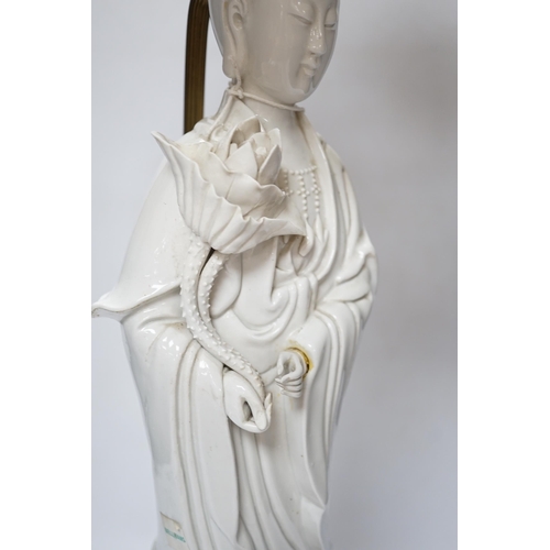 536 - A Chinese blanc de chine figure of Guanyin, 71cm with shade