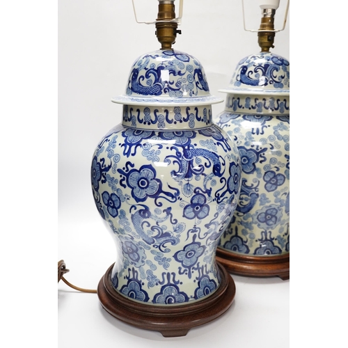 542 - A pair of modern Chinese blue and white table lamps