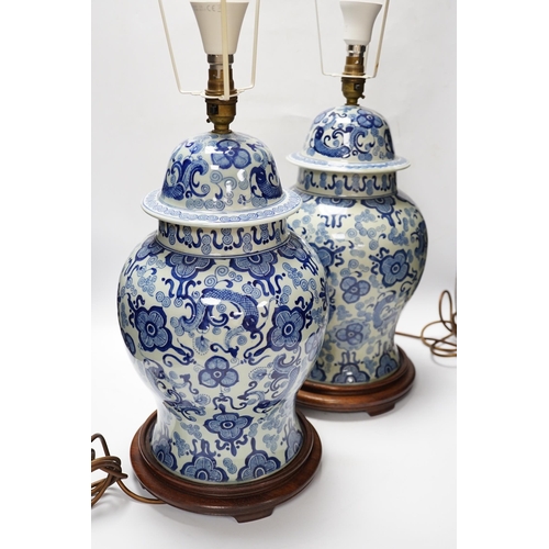 542 - A pair of modern Chinese blue and white table lamps