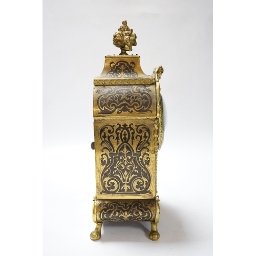 550 - A late 19th century French cut brass inlaid mantel clock, 32cm high