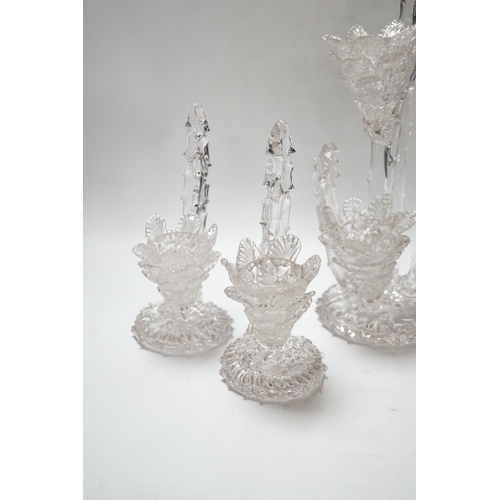 551 - A set of four glass stylistic floral candlesticks, (one double holder the other three single holder)... 