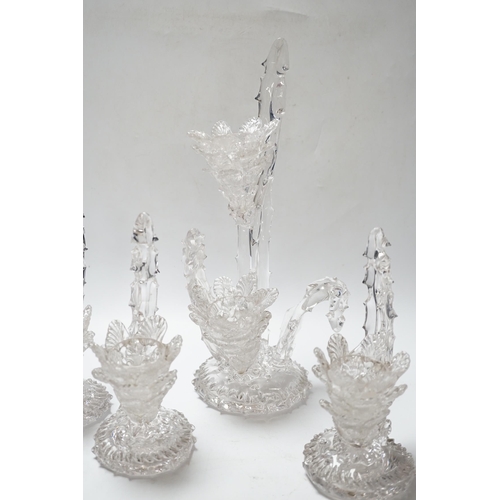 551 - A set of four glass stylistic floral candlesticks, (one double holder the other three single holder)... 