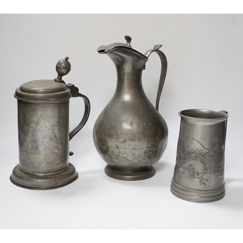 555 - Six pewter items including an 18th-century Continental wriggle work tankard, two more tankards and t... 