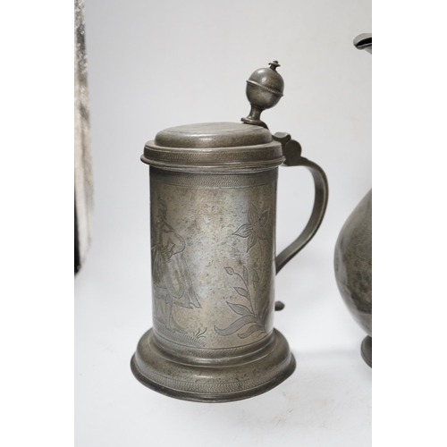 555 - Six pewter items including an 18th-century Continental wriggle work tankard, two more tankards and t... 