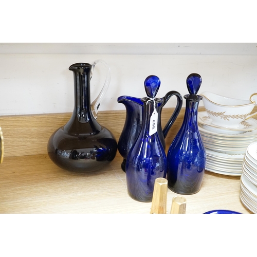 557 - A collection of Bristol blue glassware and other coloured glass including two blue glass decanters, ... 