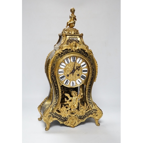 558 - A large Louis XV style cut brass inlaid mantel clock, with a two train, French movement, striking on... 