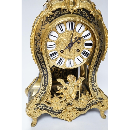 558 - A large Louis XV style cut brass inlaid mantel clock, with a two train, French movement, striking on... 