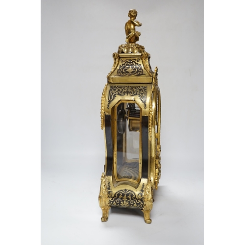 558 - A large Louis XV style cut brass inlaid mantel clock, with a two train, French movement, striking on... 