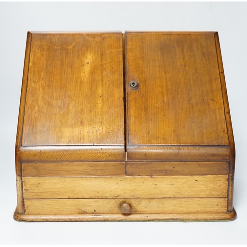 563 - An Edwardian oak stationery casket, 31cm high, 38cm wide, 21.5cm deep