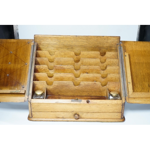 563 - An Edwardian oak stationery casket, 31cm high, 38cm wide, 21.5cm deep