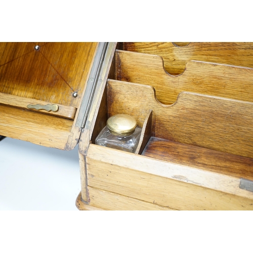 563 - An Edwardian oak stationery casket, 31cm high, 38cm wide, 21.5cm deep