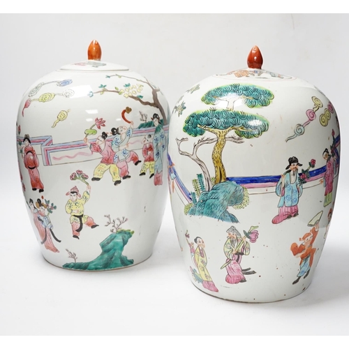 564 - A pair of Chinese famille rose ovoid jar and covers, 32cm high