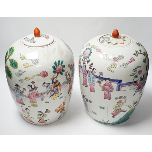 564 - A pair of Chinese famille rose ovoid jar and covers, 32cm high