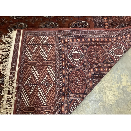 59 - A Bokhara red ground carpet,310 x 237cm