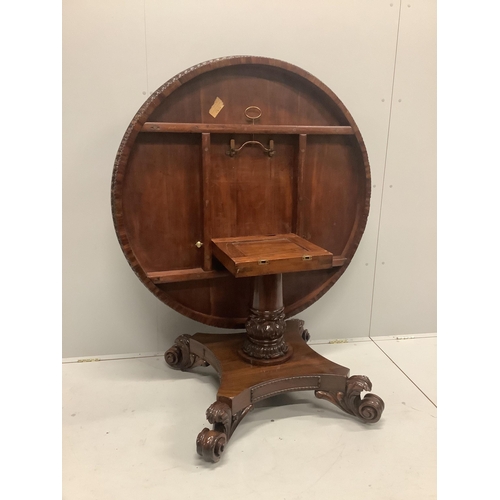 64 - A William IV circular rosewood tilt top pedestal dining table, diameter 121cm, height 72cm