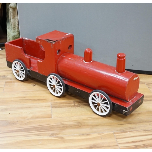 641 - A painted wood pull along locomotive, 96cm