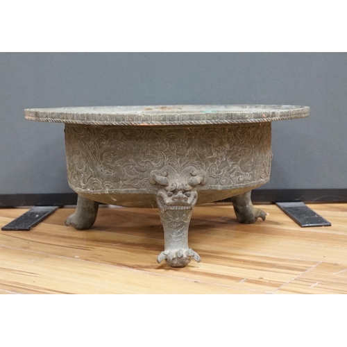 644 - A large and heavy Chinese bronze tripod basin, Xuande mark but 19th century, the broad rim cast in r... 