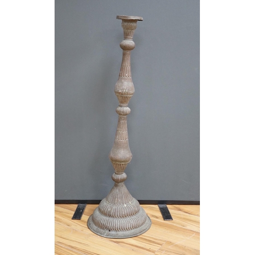 645 - An Islamic copper candle stand, 19th/early 20th century, 97cm high