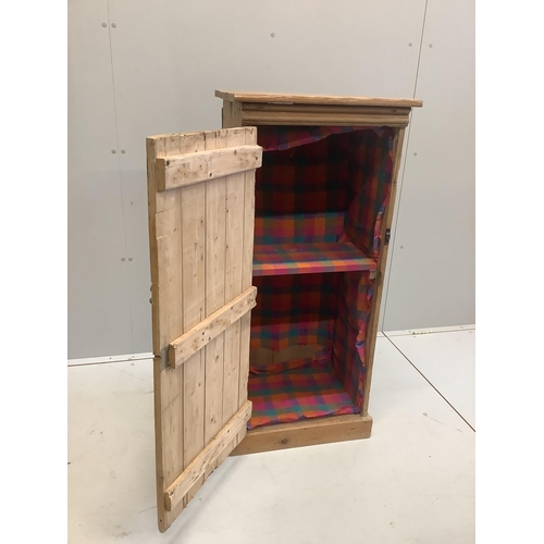 96 - A narrow pine single door cabinet, width 52cm, depth 37cm, height 113cm