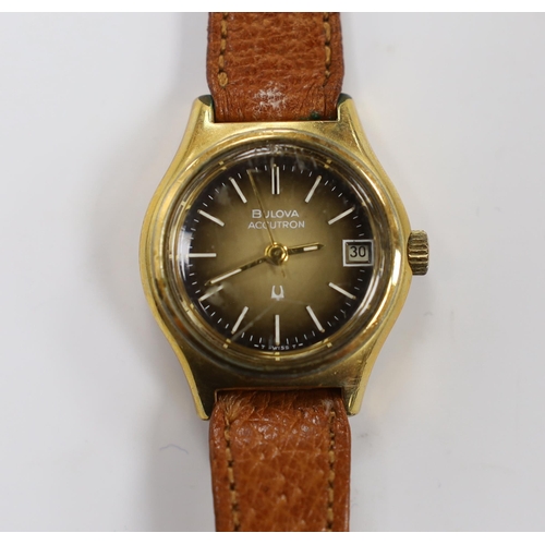 967 - A lady's steel and gold plated Bulova Accutron wrist watch, on a leather strap.