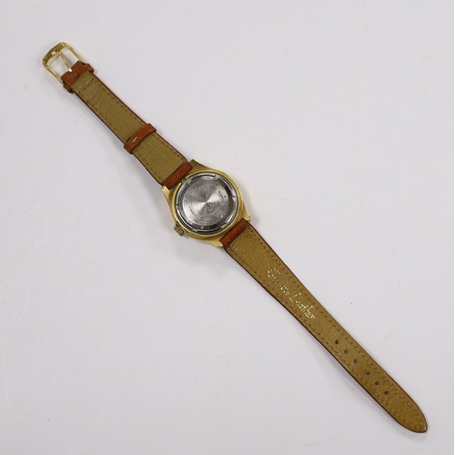 967 - A lady's steel and gold plated Bulova Accutron wrist watch, on a leather strap.