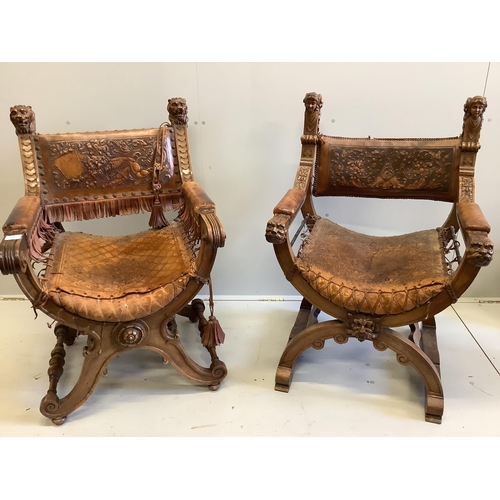 1065 - Two continental carved x-framed elbow chairs, each with tooled leather backs and carved terminals, l... 