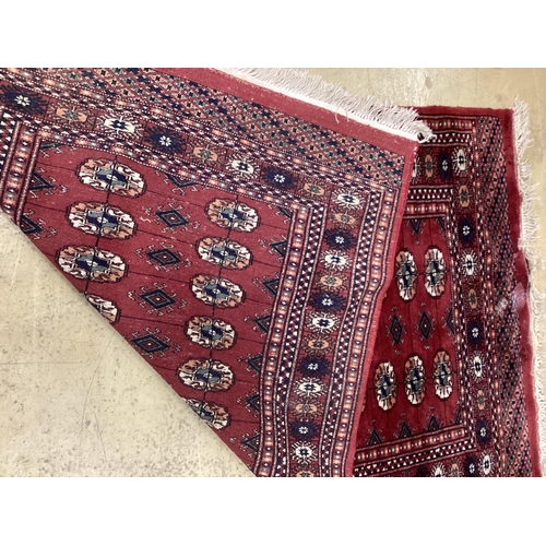 1109 - A Bokhara red ground rug, 150 x 96cm