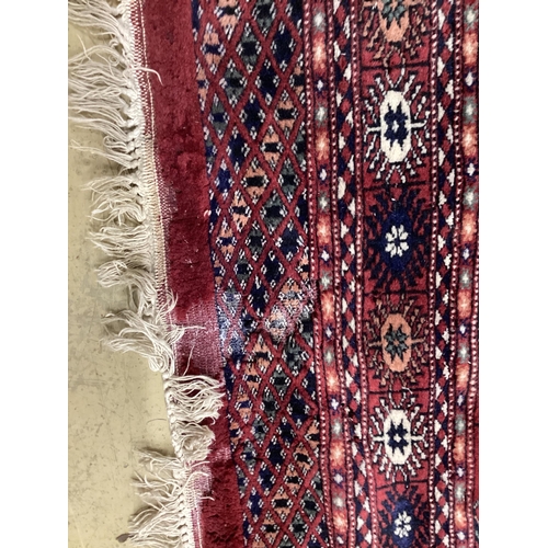 1109 - A Bokhara red ground rug, 150 x 96cm