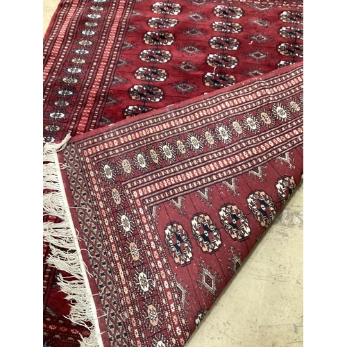 1132 - A Bokhara red ground rug, 145 x 120cm